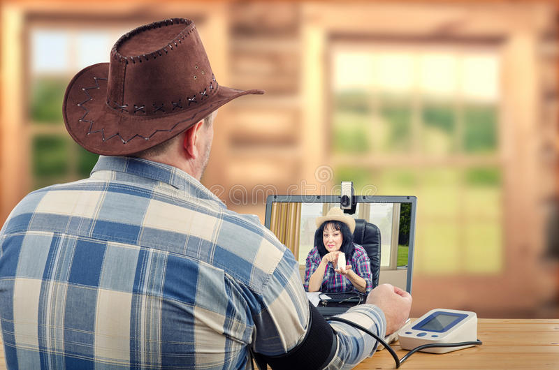 country-doctor-recommends-pills-farmer-suffered-high-pressure-brown-hat-checkered-shirt-sits-wooden-desk-takes-blood-77494161